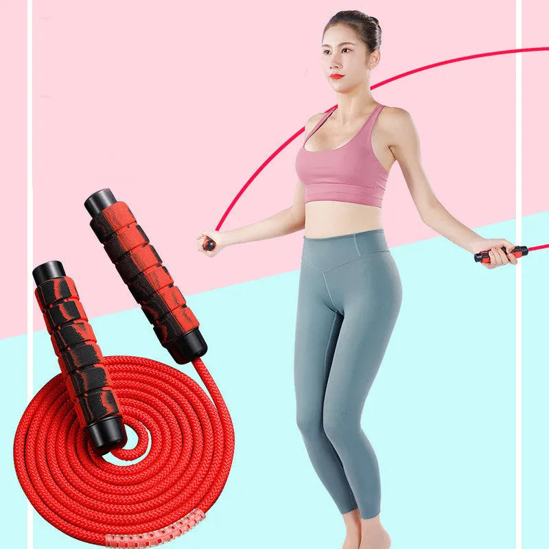Red polyester weight-bearing skipping rope with 16cm handles on a white background