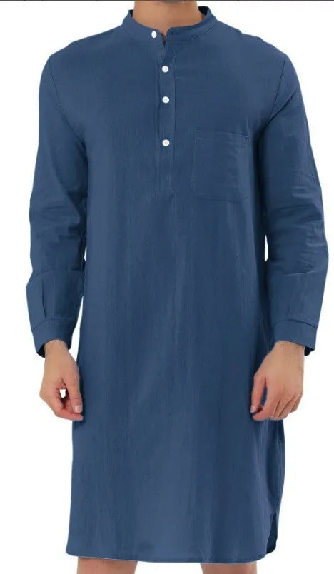 Man wearing a dark blue cotton robe shirt with button front and chest pocket