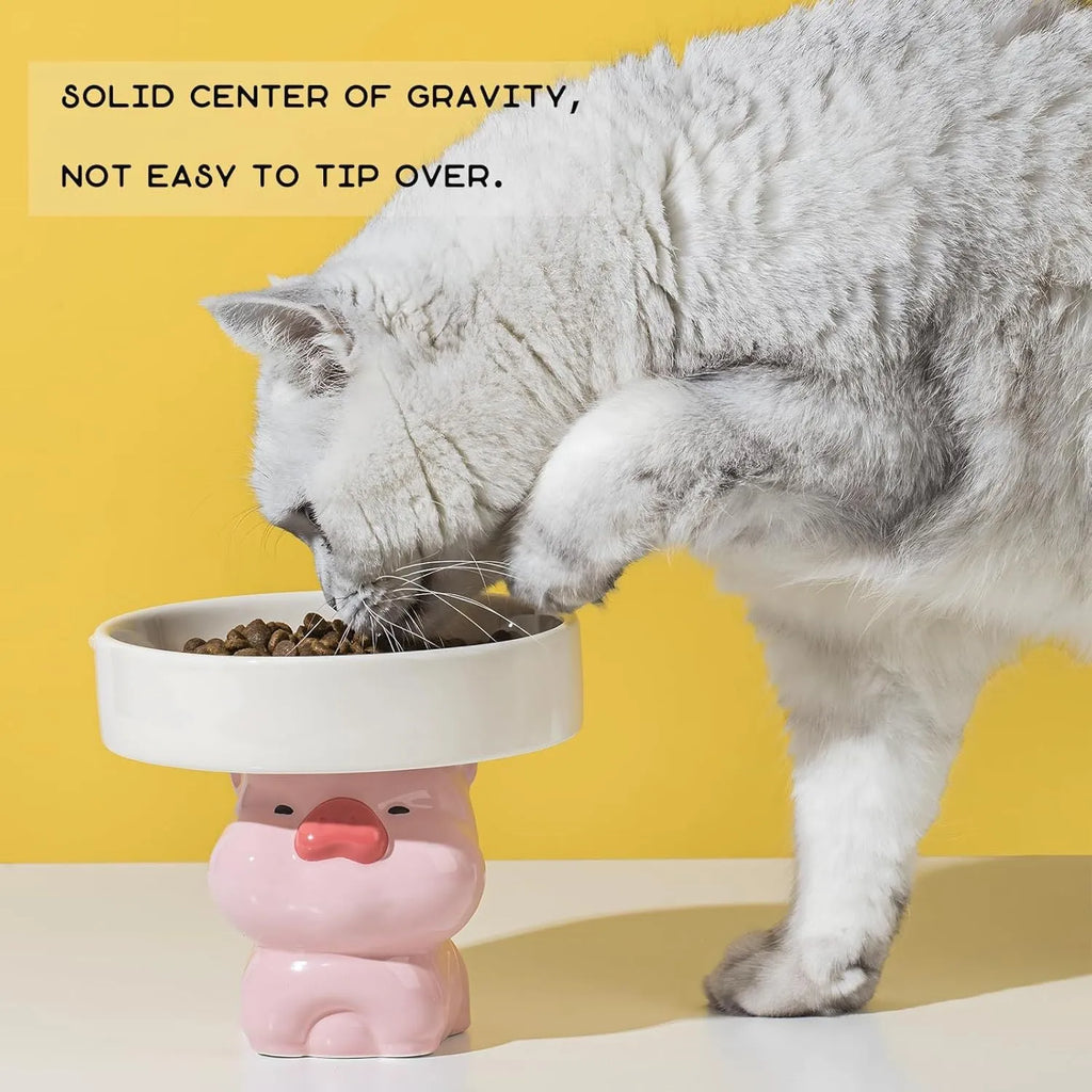 Raised ceramic cat food bowl in animal theme design, showing elevated height and wide bowl.