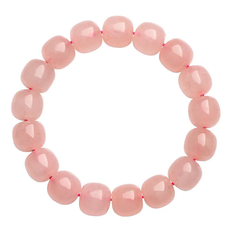Pink crystal barrel bead stretch bracelet with 8-10mm polished beads on a wrist.