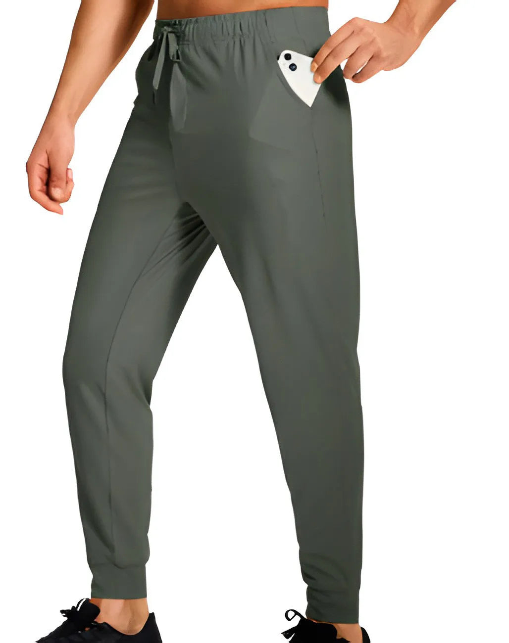 Men's loose-fitting casual polyester trousers in a solid colour on a hanger.