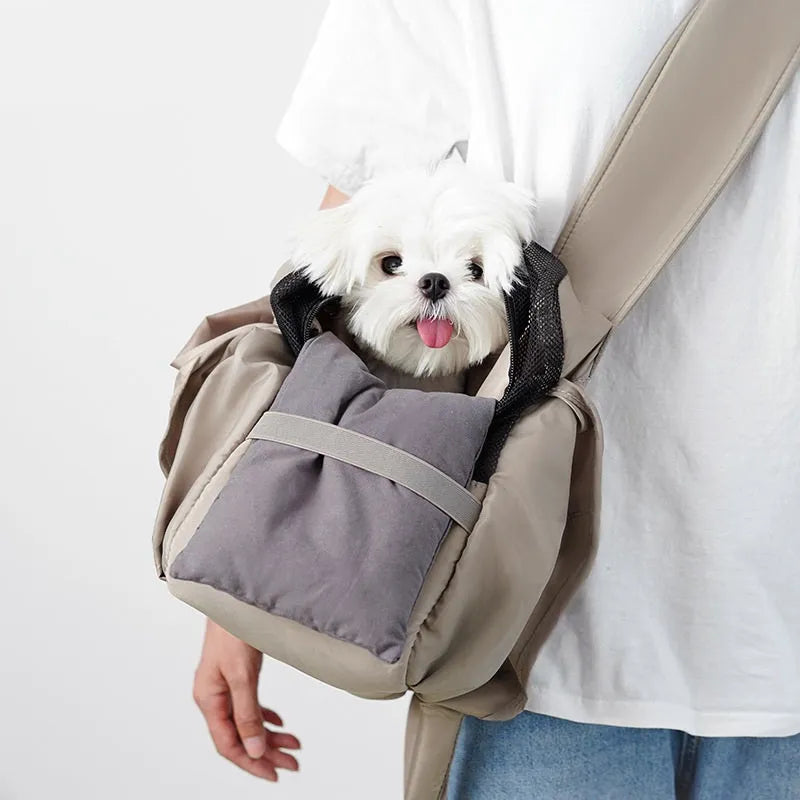 Apricot coloured cloth pet carrier handbag for small dogs or cats, showing carrying handles.