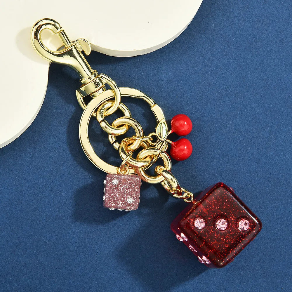 Square metal dice keychain pendant with cherry electroplated finish and keychain attachment
