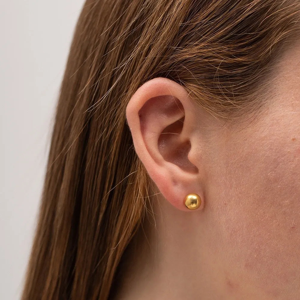 Stainless steel ball stud earrings in gold and silver colours showing 3mm to 6mm size range