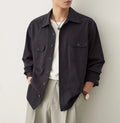 Men's light sand rice casual lapel collar long sleeve shirt on a hanger.