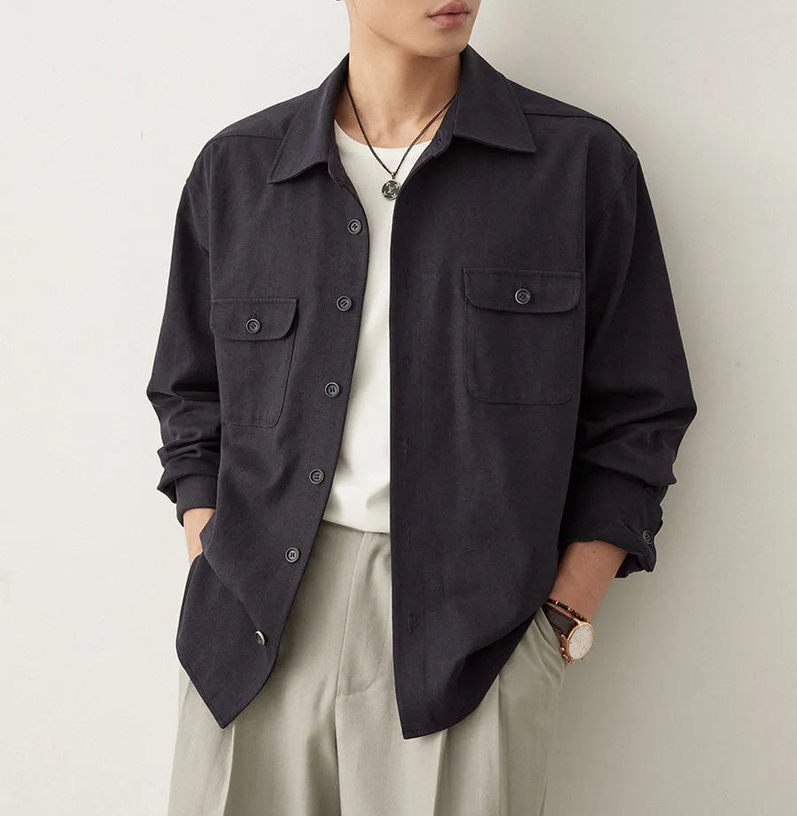 Men's light sand rice casual lapel collar long sleeve shirt on a hanger.