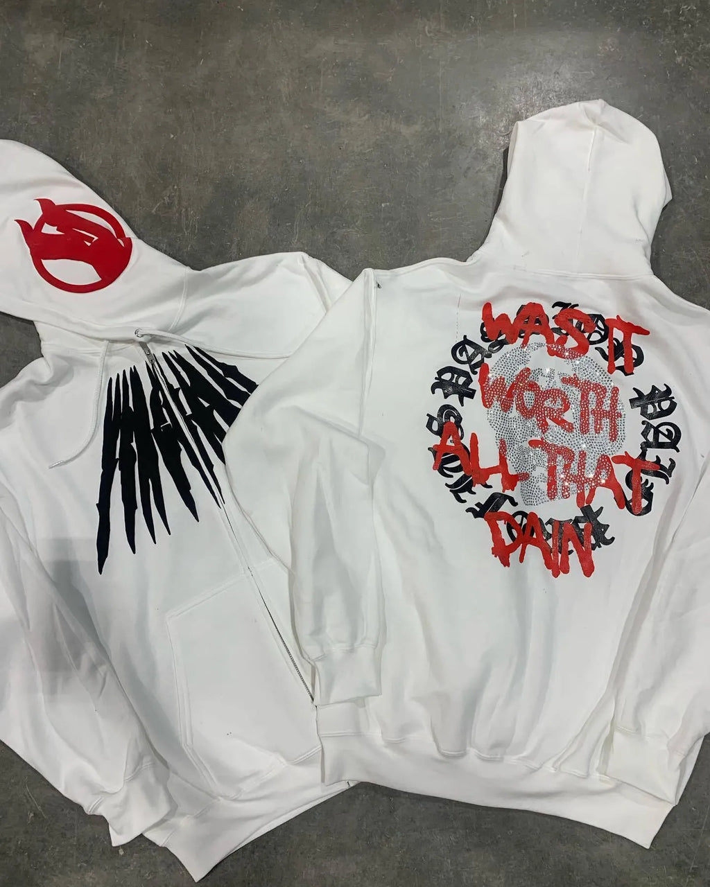 Black loose hooded sweatshirt with white skull print and rhinestone details, cardigan style with long sleeves