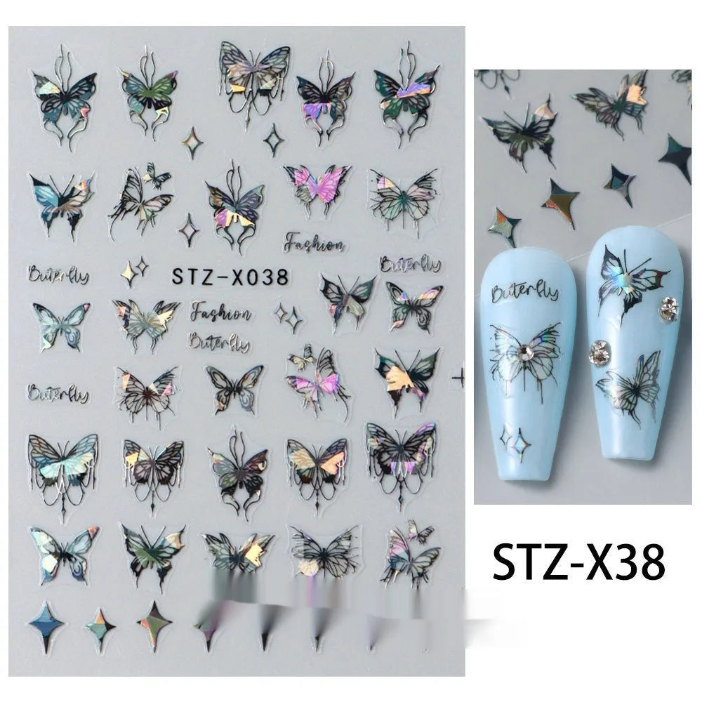 Close-up of a cartoon-style nail sticker with black and silver strips and a love pattern design on a fingernail.