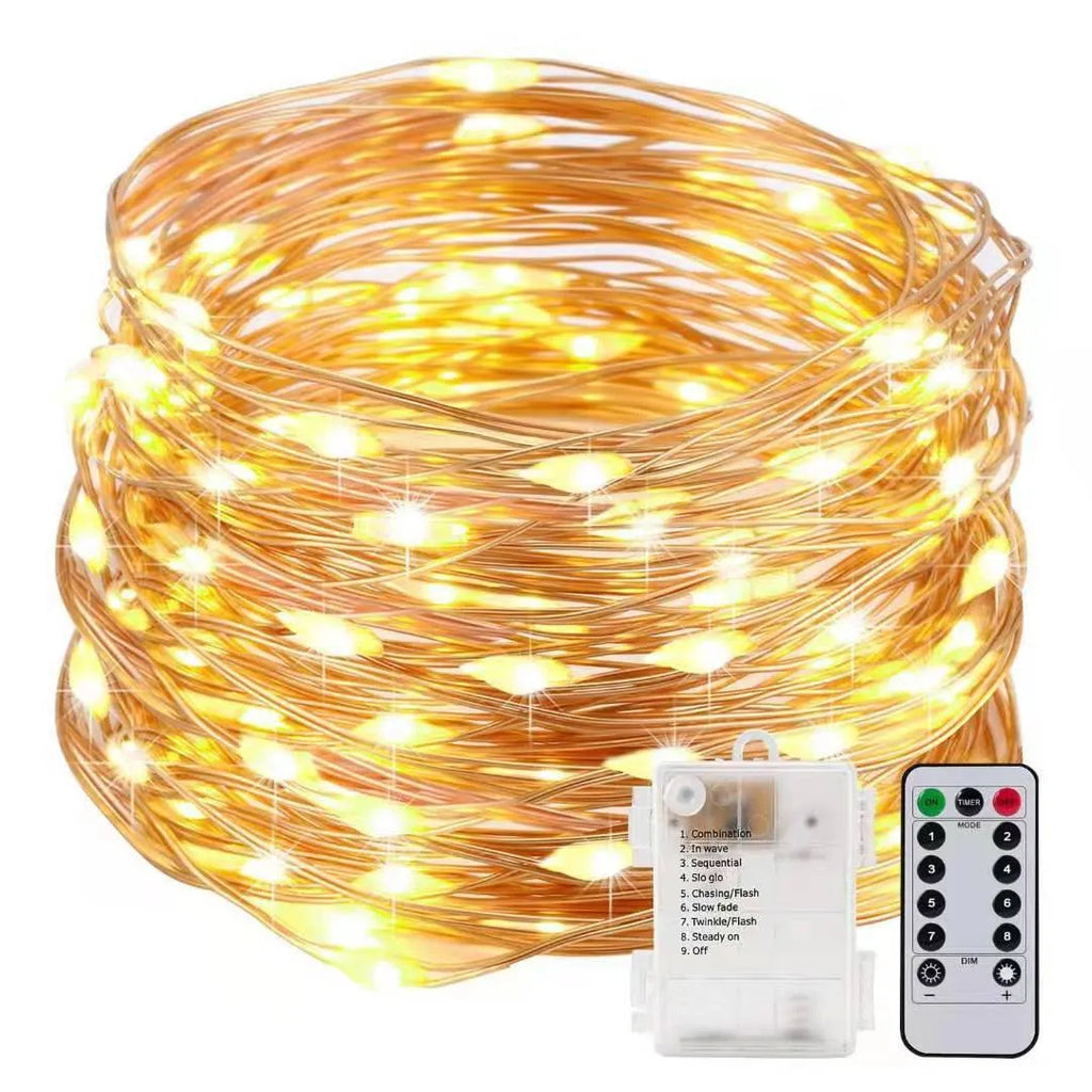 Copper wire battery-operated string lights wrapped around branch with multiple LED colours illuminated