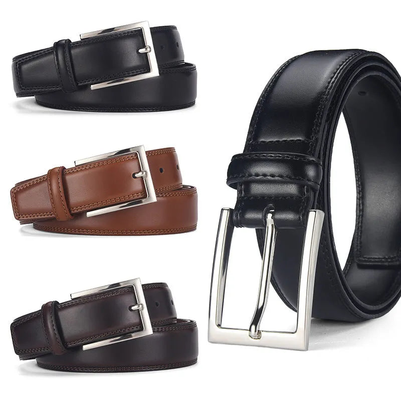 Men's black genuine leather belt with a silver alloy pin buckle on a flat surface