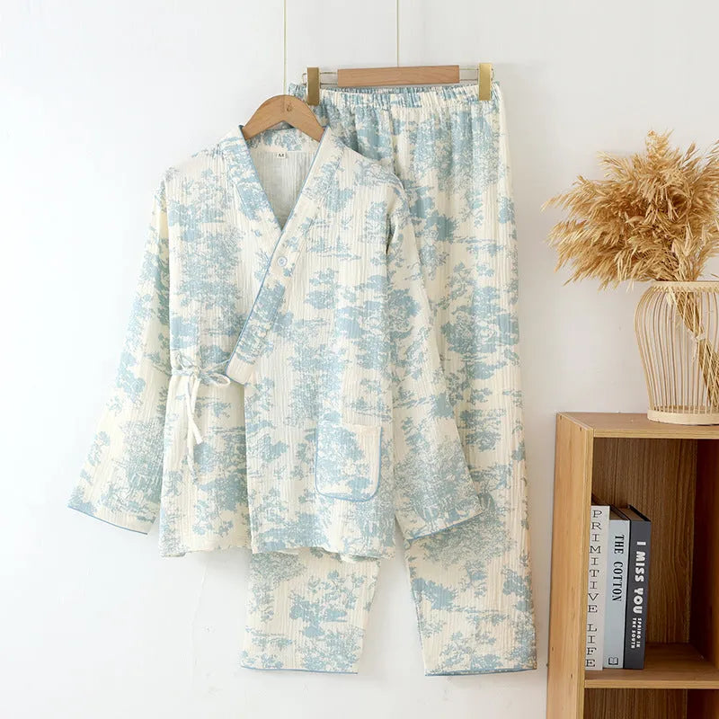 Women's pink cotton gauze long sleeve top and trousers matching loungewear set laid flat.