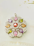 Women's flower-shaped zircon pendant necklace in gold tone on a model.