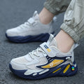 Boy's dark blue and black Velcro-fastened platform sports running shoes with breathable mesh upper.