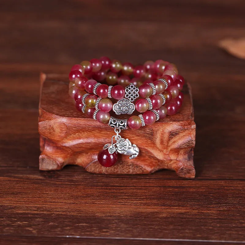 Handmade natural watermelon crystal bracelet with Chinese knot closure in geometric national style design