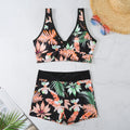 Women's two-piece printed swimsuit set with sleeveless top and boxer shorts in a multi-colour design.