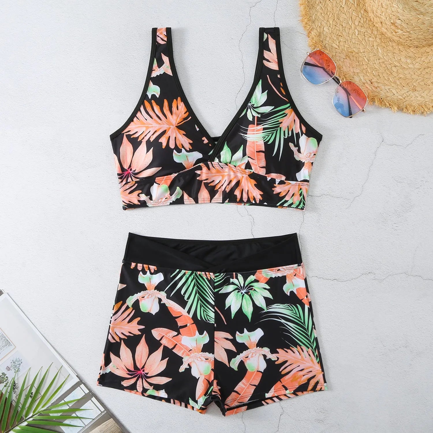 Women's two-piece printed swimsuit set with sleeveless top and boxer shorts in a multi-colour design.