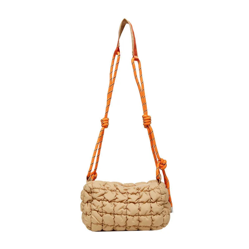 Soft pillow-shaped nylon messenger bag in multiple colours with a single shoulder strap.