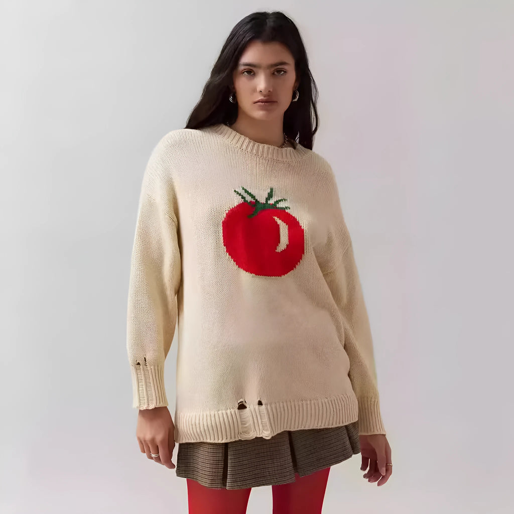 Women's beige loose-fit acrylic Jacquard knit sweater with round neck and long sleeves laid flat.