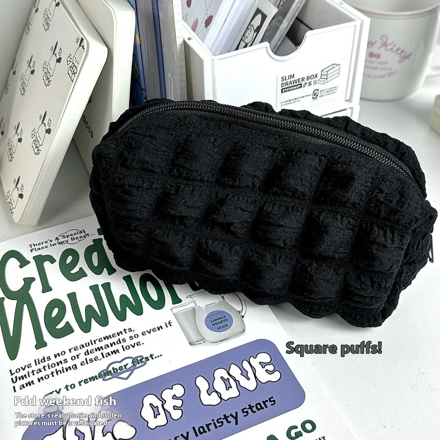Cream puff fabric pencil case in beige or black colour with zippered closure