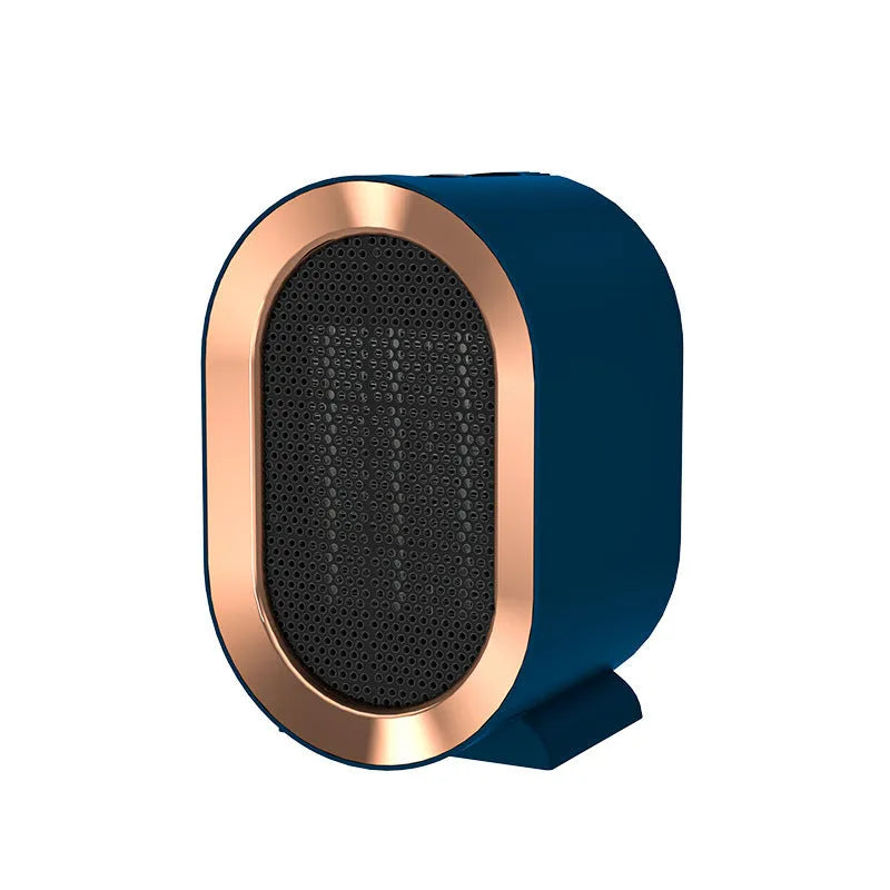 Compact black desktop electric fan heater with mechanical control dials and a safety grille.