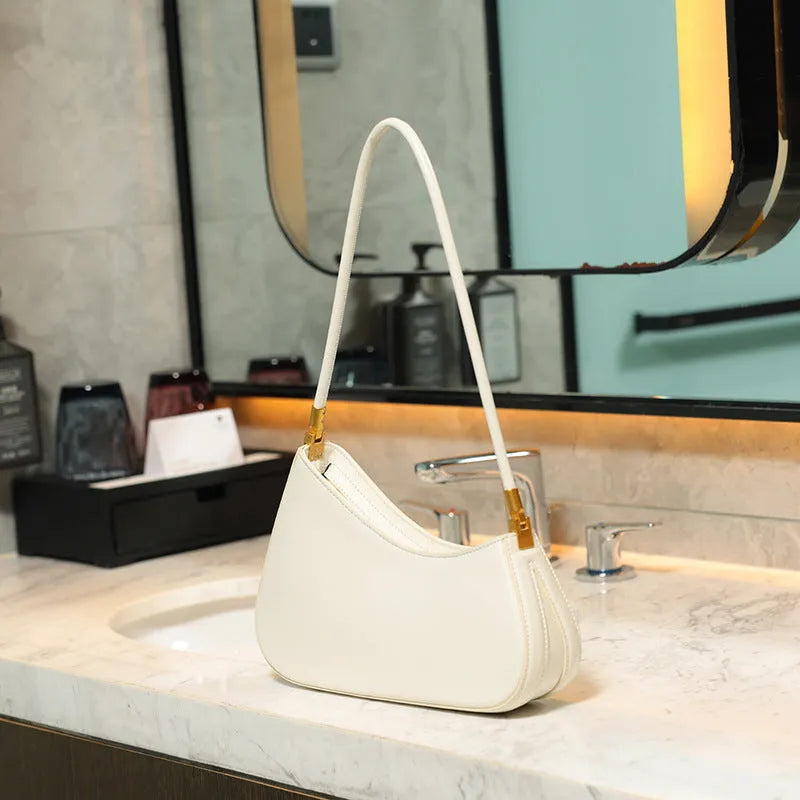 Women's oval retro underarm bag in PU leather with single strap and sewing line detailing