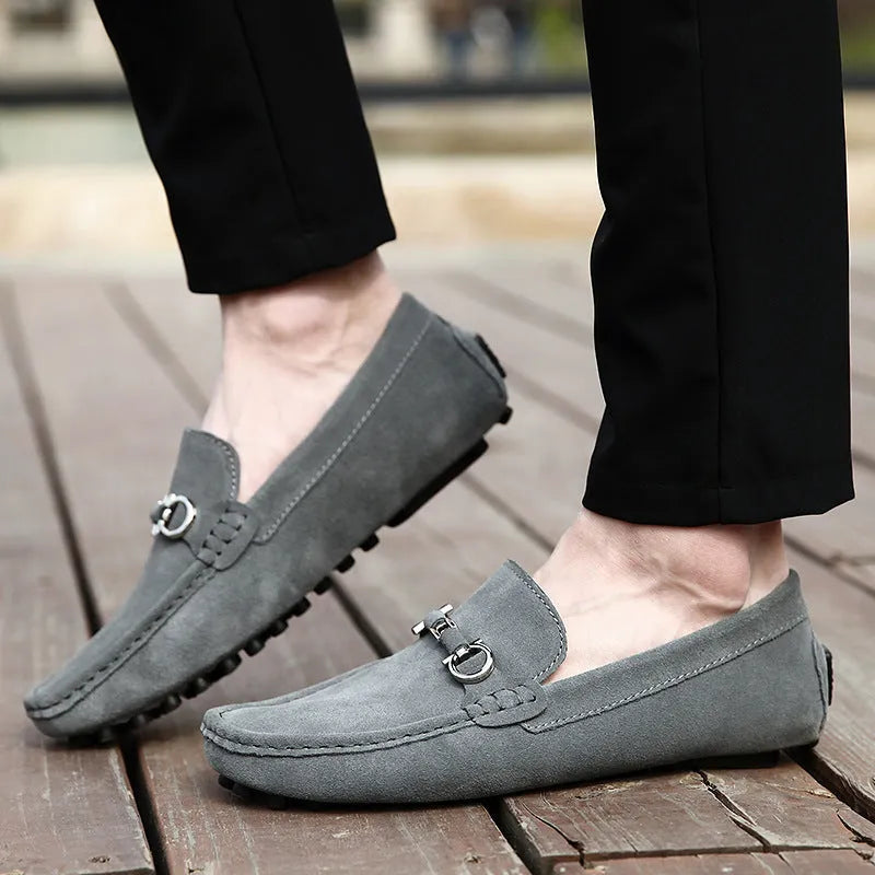 Men's black slip-on leather shoes with square toe and decorative stitching