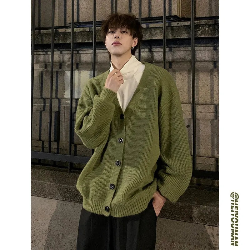 Men's loose fit casual cardigan sweater in army green, shown on a hanger.