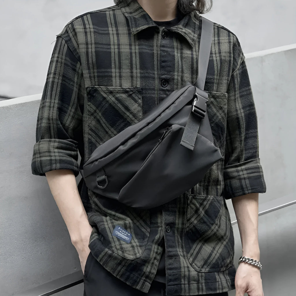 Black slanted chest bag with Oxford fabric construction and visible sewing lines