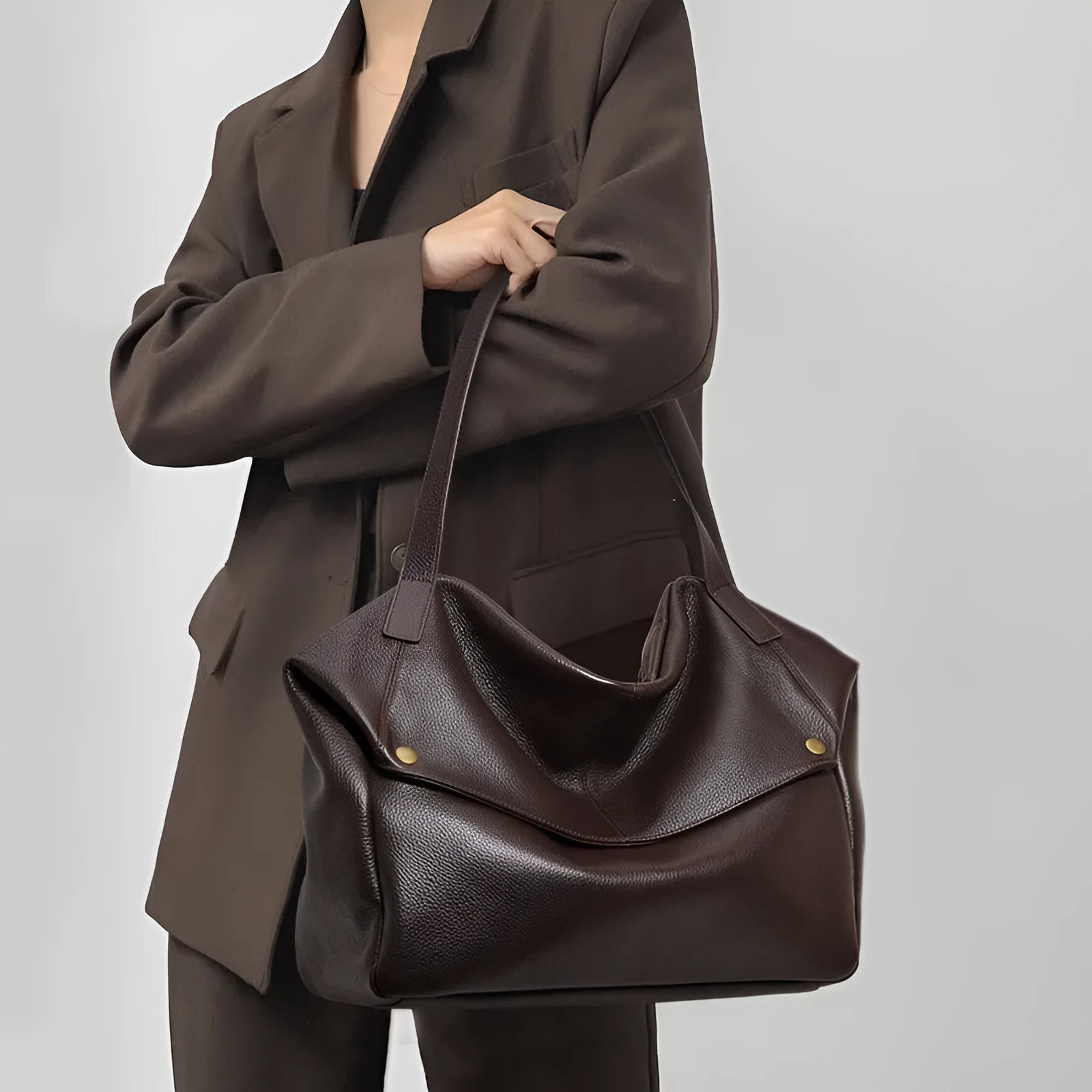 Brown genuine leather women's shoulder bag with a structured square shape and a top handle.