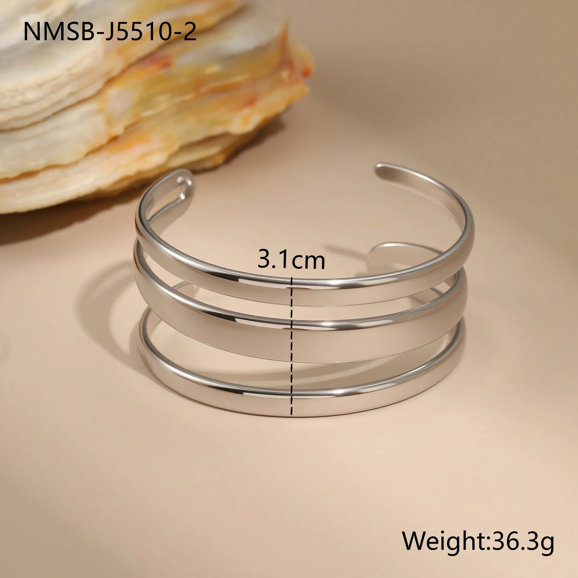 Stainless steel women's bracelet with simple opening clasp and geometric line design in gold electroplated finish