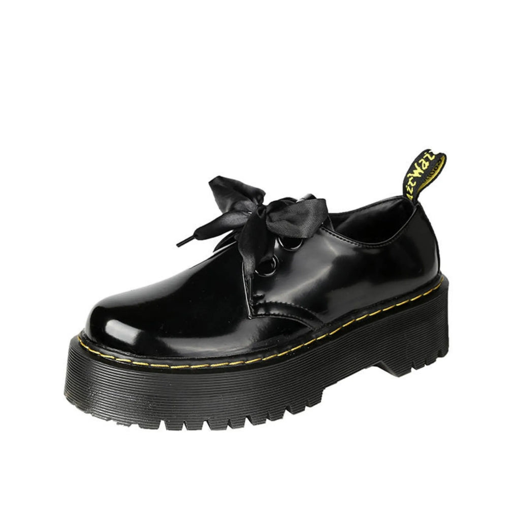 Women's thick soled leather shoes with ribbon and cross strap details in white or black