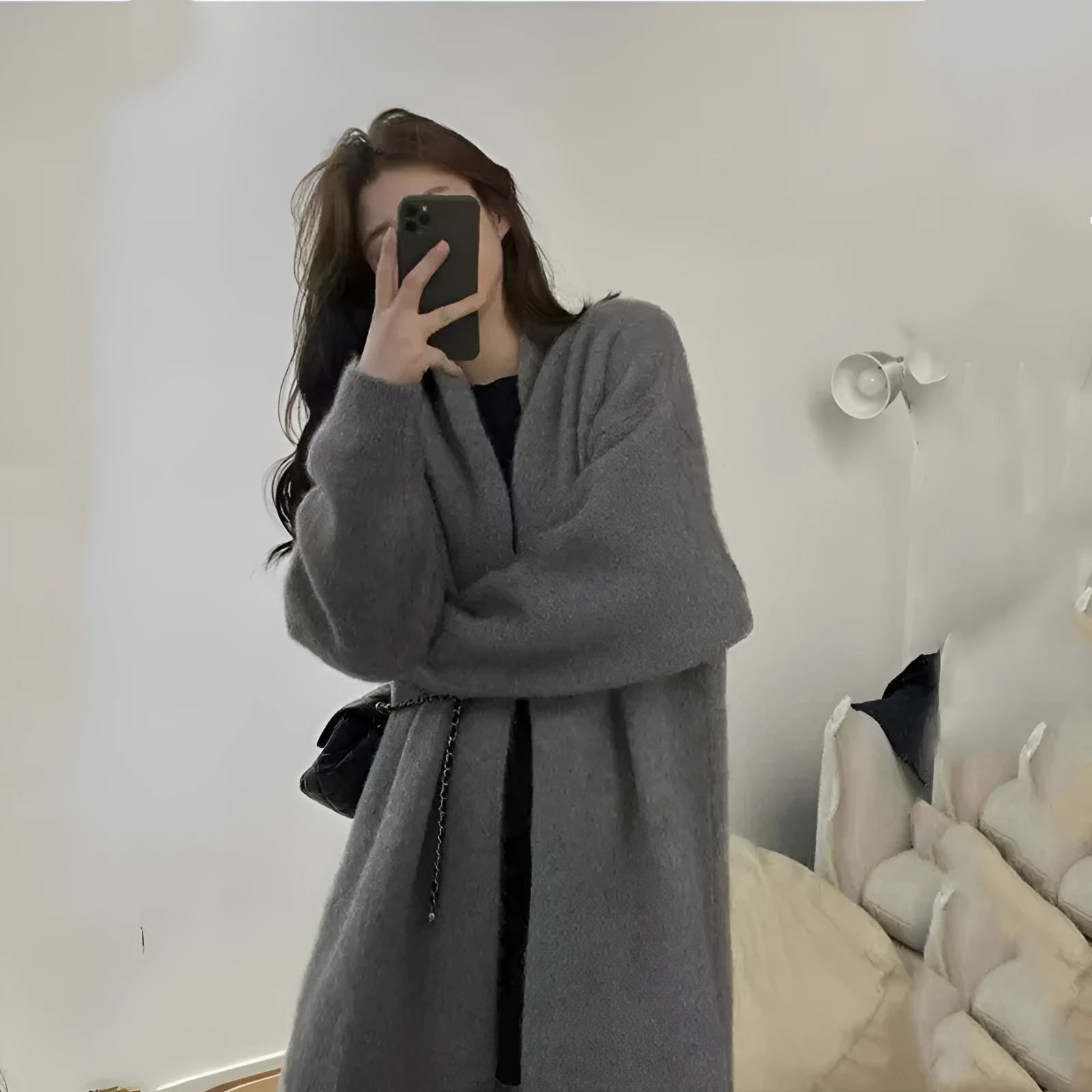 Women's loose knitted cardigan in chenille fabric showing 65cm length and solid colour options