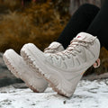 Men's beige cowhide leather hi-top hiking shoes with a platform sole, on a neutral background.