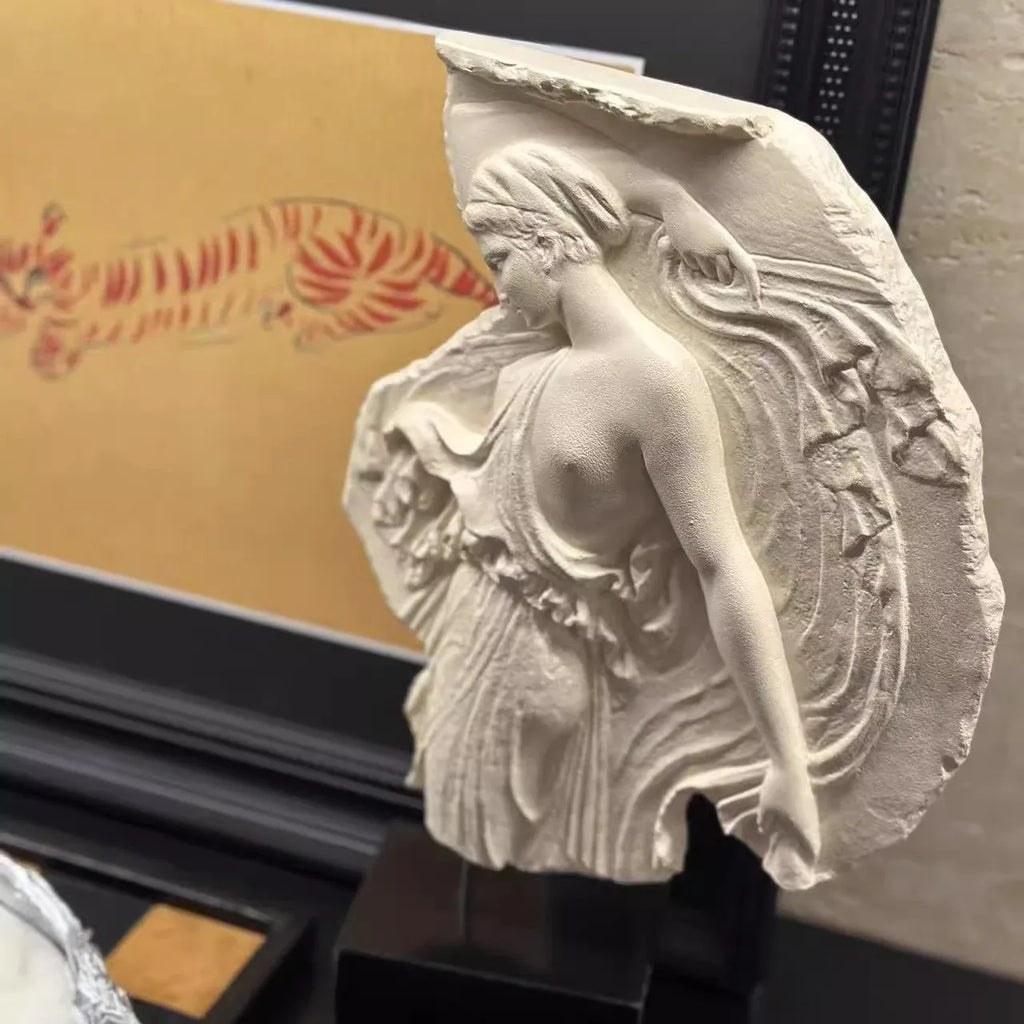 A 35cm tall synthetic resin wine goddess ornament on a table.