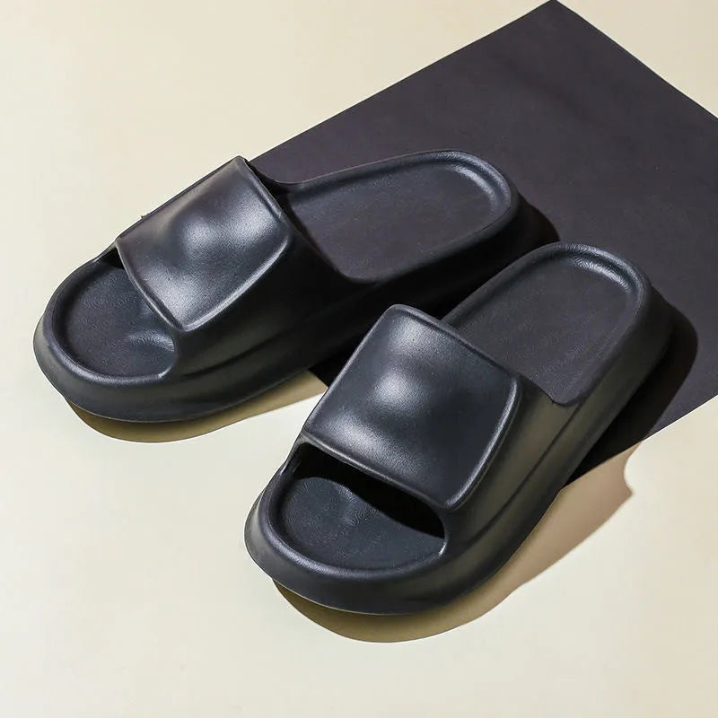 Pair of thickened EVA flip-flop slippers in a chosen colour, showing the non-slip sole and unisex design.