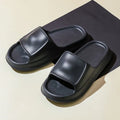 Pair of thickened EVA flip-flop slippers in a chosen colour, showing the non-slip sole and unisex design.