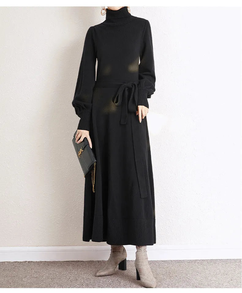 A rose red turtleneck knit dress with long sleeves, an elastic waist, and a loose mid-length skirt.