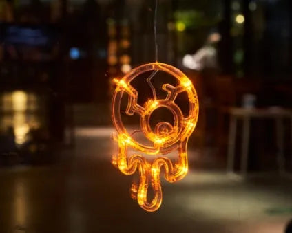 Seven Halloween-themed LED hanging lights with suction cups including spiders, pumpkins and ghosts