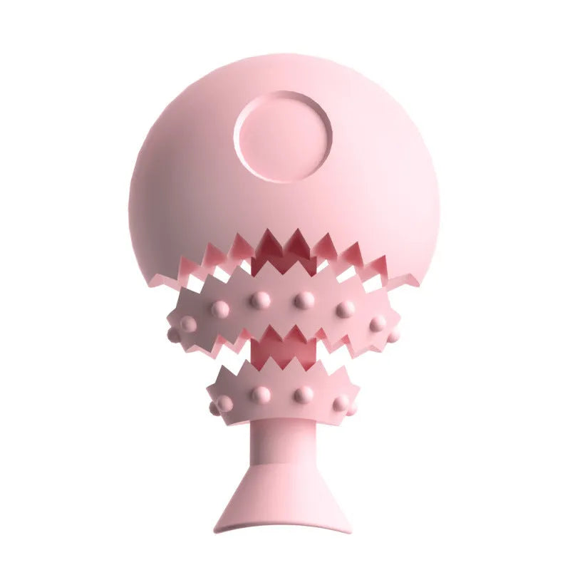 Blue fish bone shaped silicone dog chew toy with a treat hole, shown next to a green and pink version.