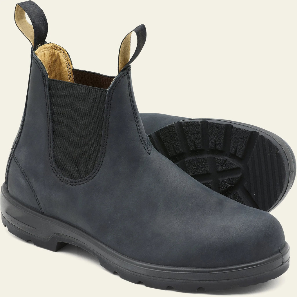 Vintage brown unisex Chelsea boot with frosted PU upper and round toe on a wooden surface.