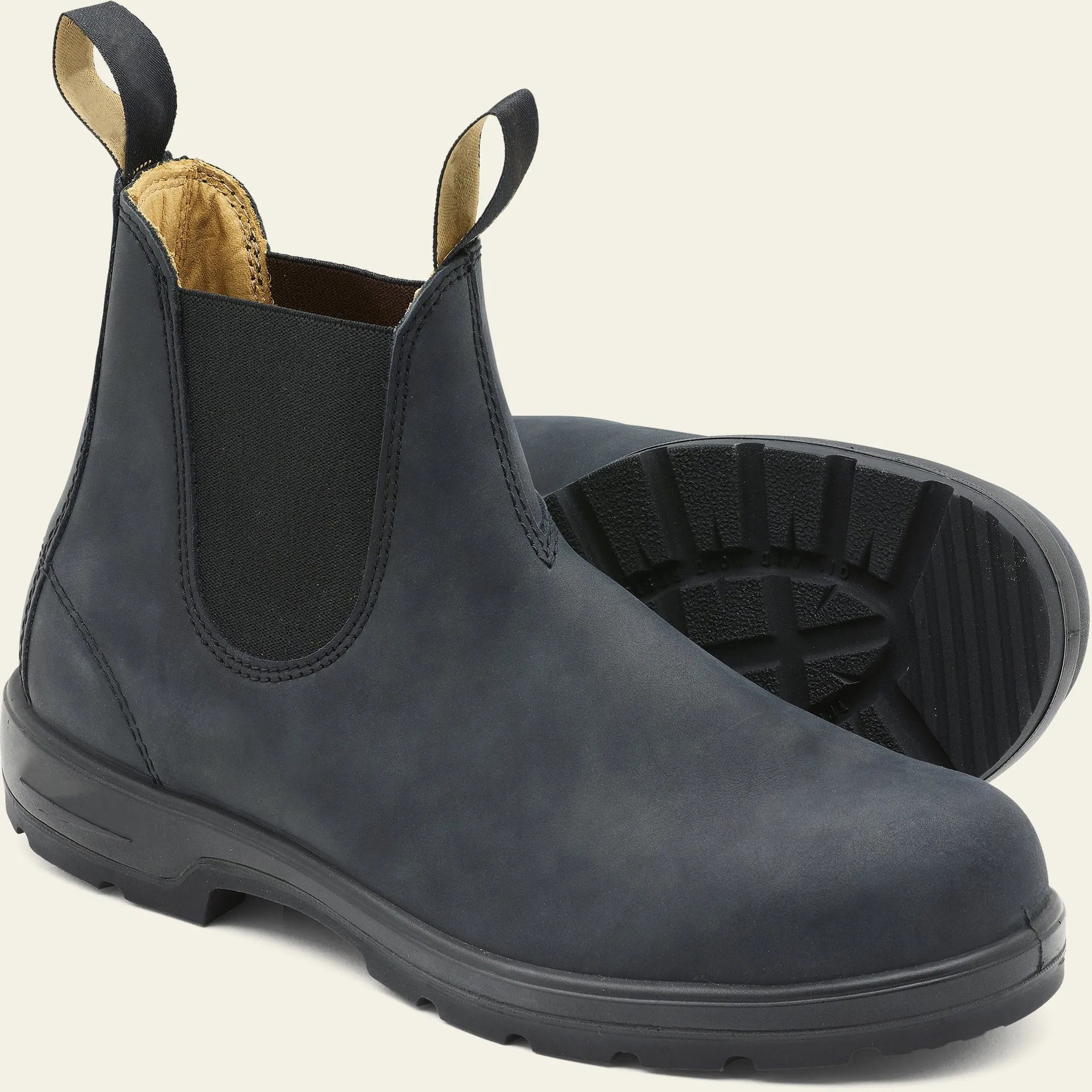 Vintage brown unisex Chelsea boot with frosted PU upper and round toe on a wooden surface.