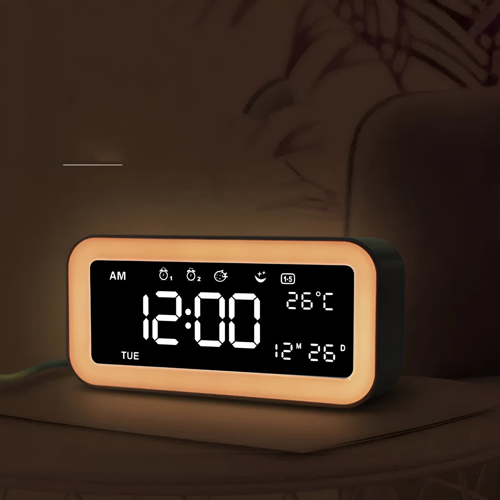 Blue rectangular LED alarm clock with atmosphere lighting on a wooden desk.