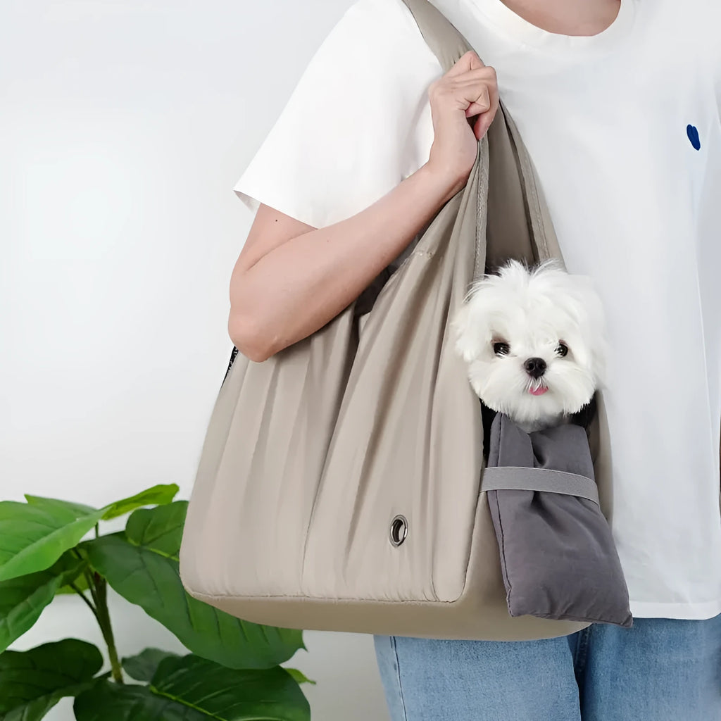 Apricot coloured cloth pet carrier handbag for small dogs or cats, showing carrying handles.