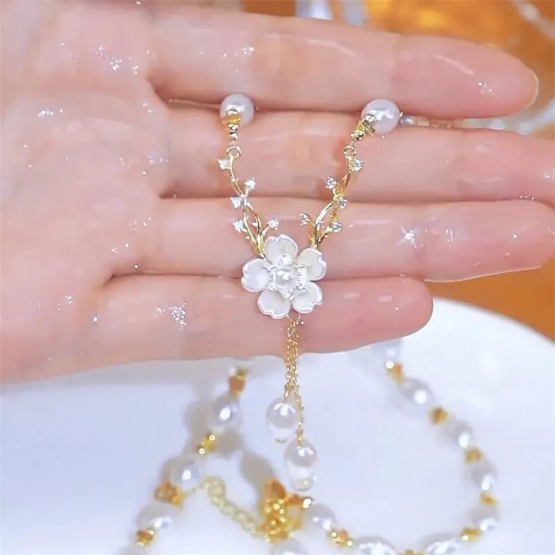 Alloy necklace with pearl flower pendant and floral design on pearl chain