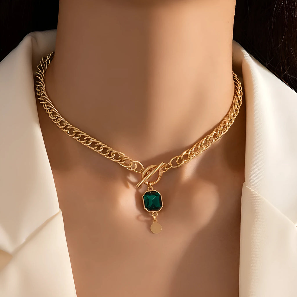 Gold electroplated titanium steel necklace with emerald zircon pendant and Cuban link chain