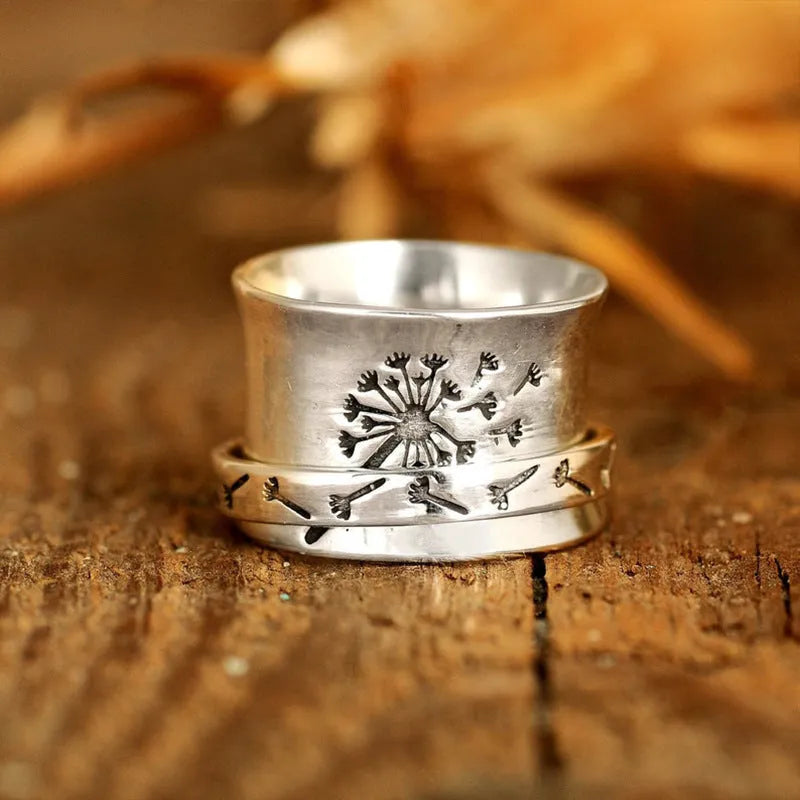 Silver rotatable flower ring with adjustable floral element and electroplated alloy construction