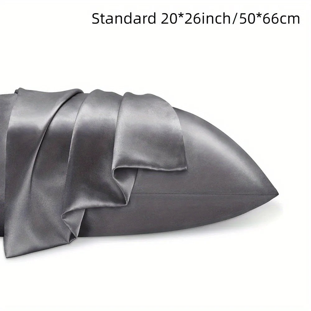 A pair of solid colour satin pillowcases in a chosen shade, showing the smooth plain weave fabric texture.