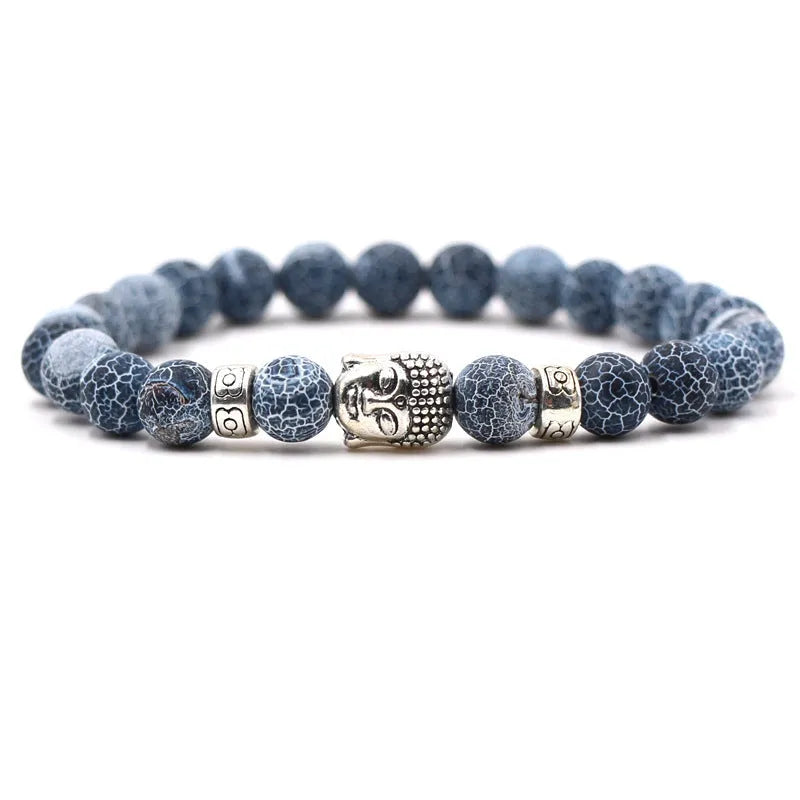 Tigereye stone Buddha head stretch bracelet with 8mm beads on a wrist.