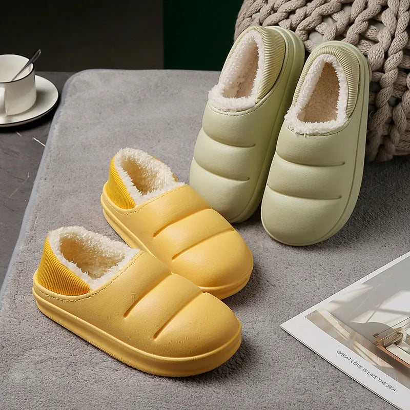 Green EVA waterproof garden slippers with non-slip sole and plush lining shown on wooden decking