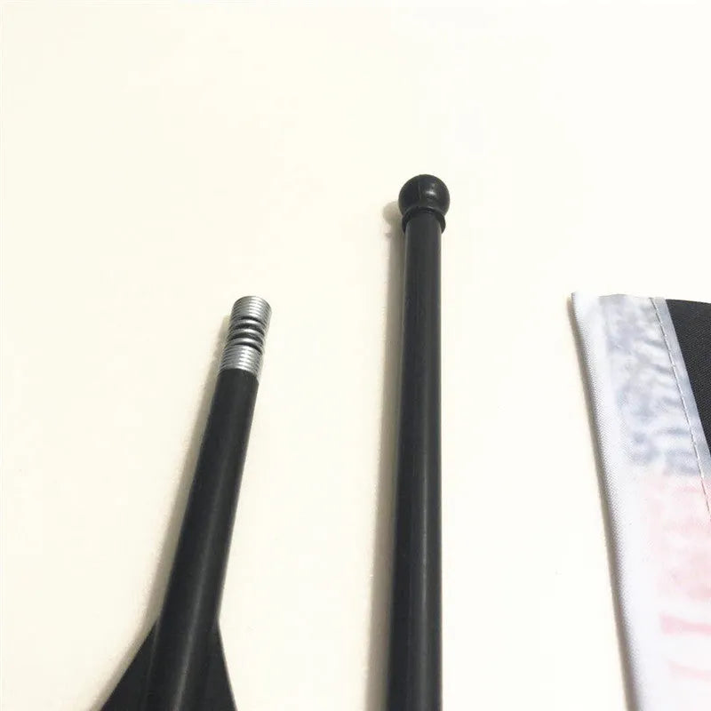 Plastic handlebar pole with attached square polyester cycling flag on a bicycle.